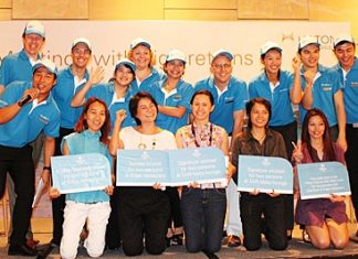 Winners of the lucky draw celebrate their winnings with Hilton Pattaya management and staff.